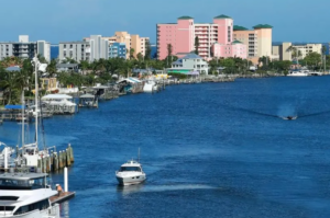 Boats on blue waterway with waterfront condos