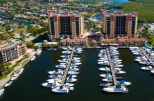 Aerial view of marina with yachts and twin towers