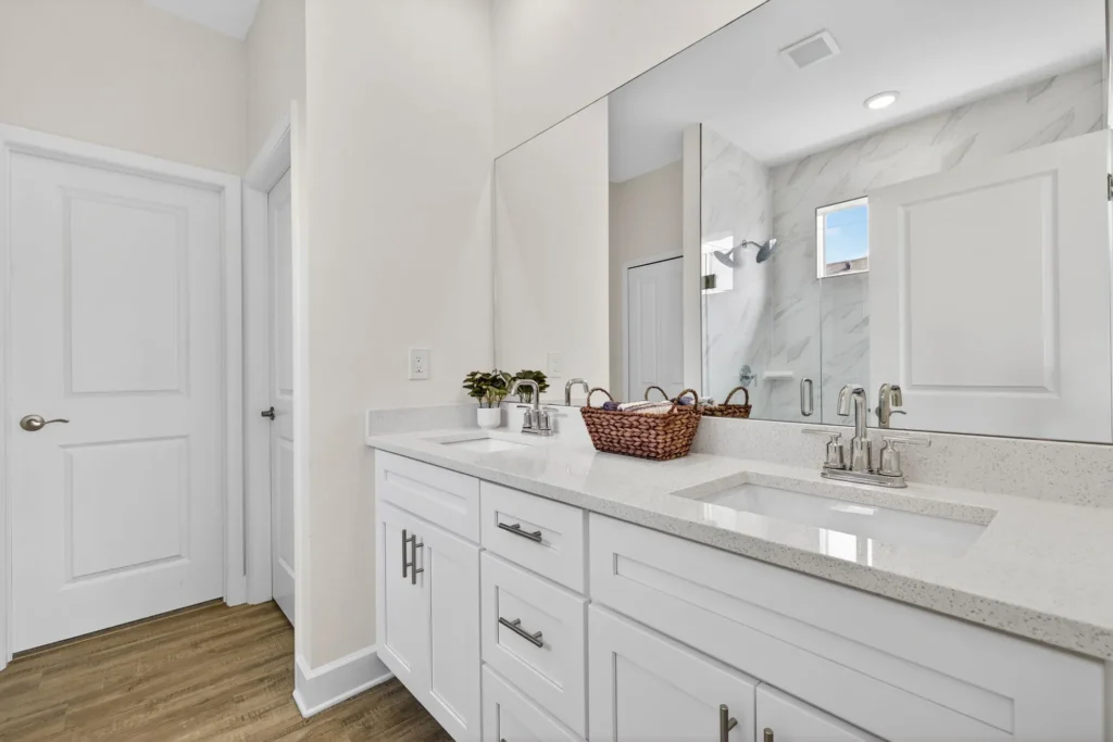 Bright bathroom vanity with double sinks and large mirror