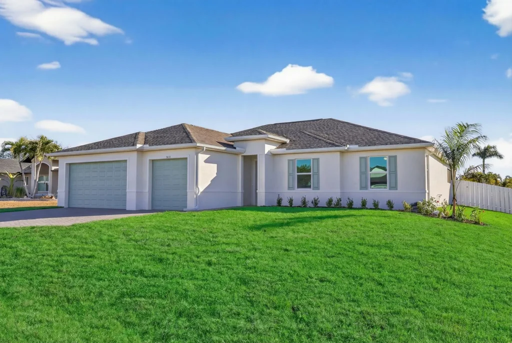 Single-story home with two-car garage and green lawn