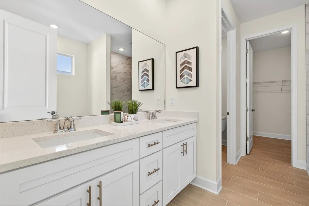 Bright bathroom with double-sink vanity and large mirror