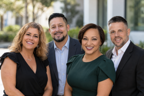 The SunLife Homes sales team smiling outdoors
