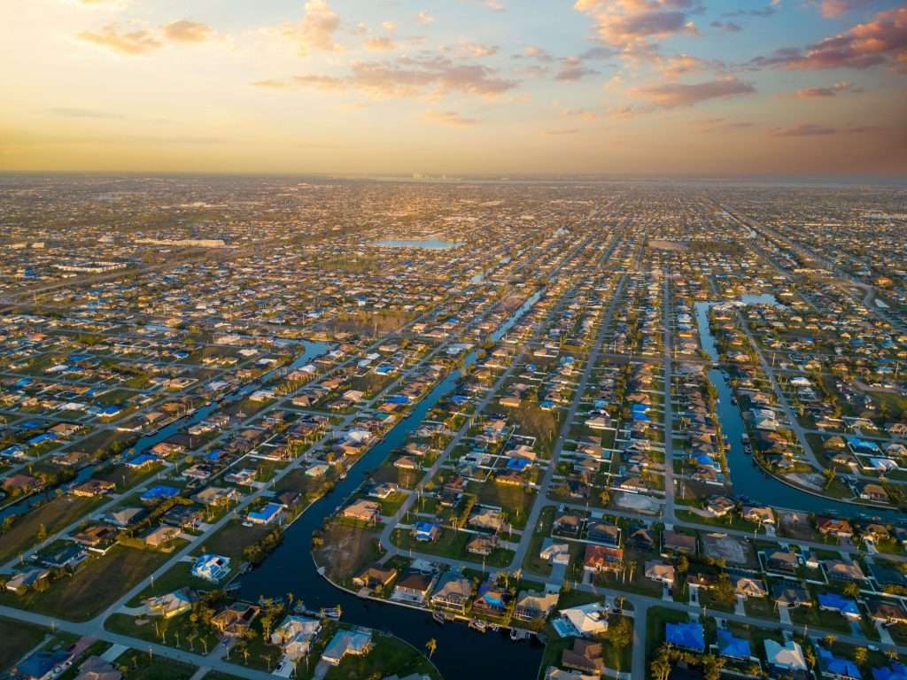 Aerial view of Cape Coral neighborhoods at sunset
