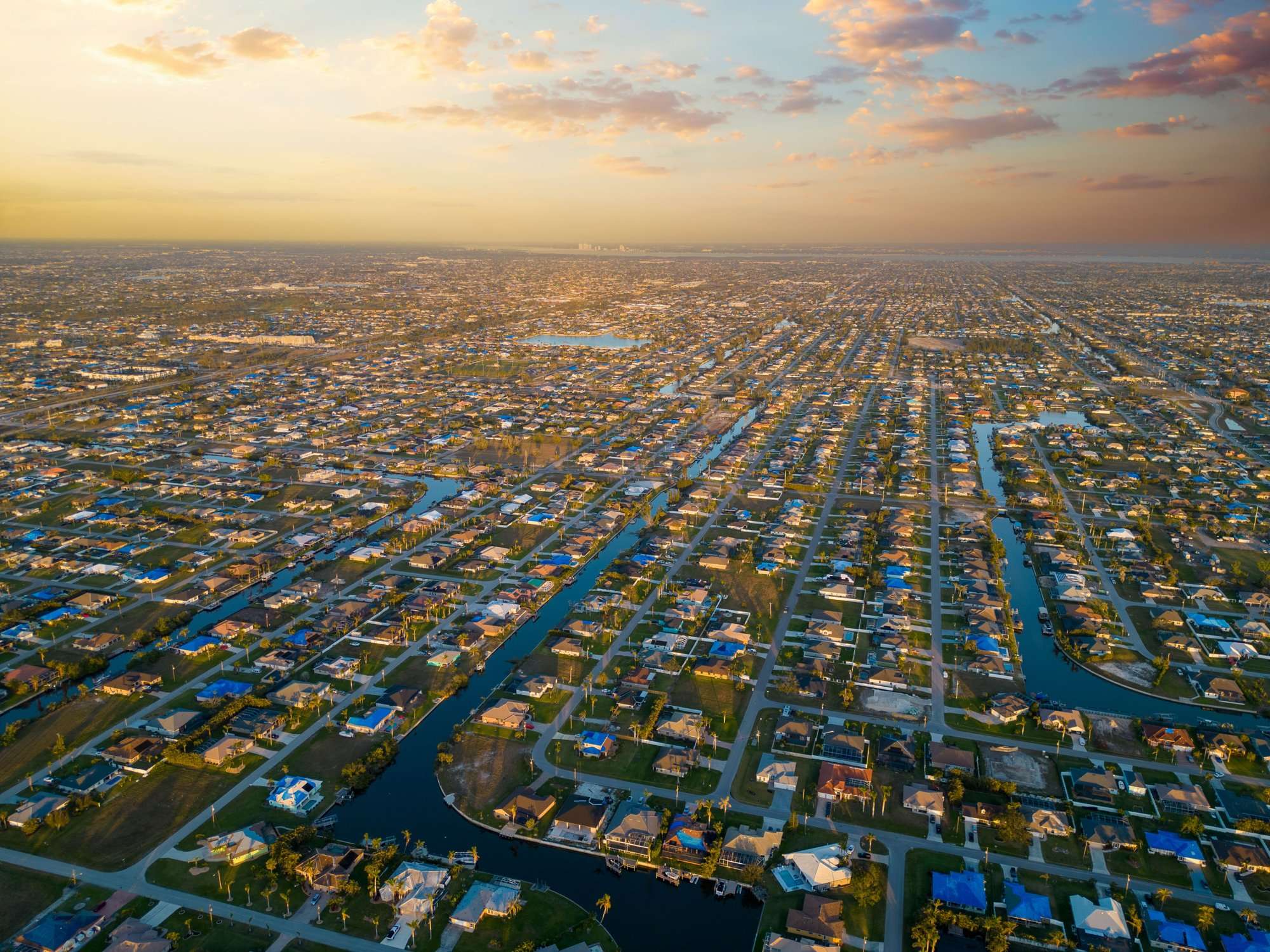Aerial view of Cape Coral neighborhoods at sunset