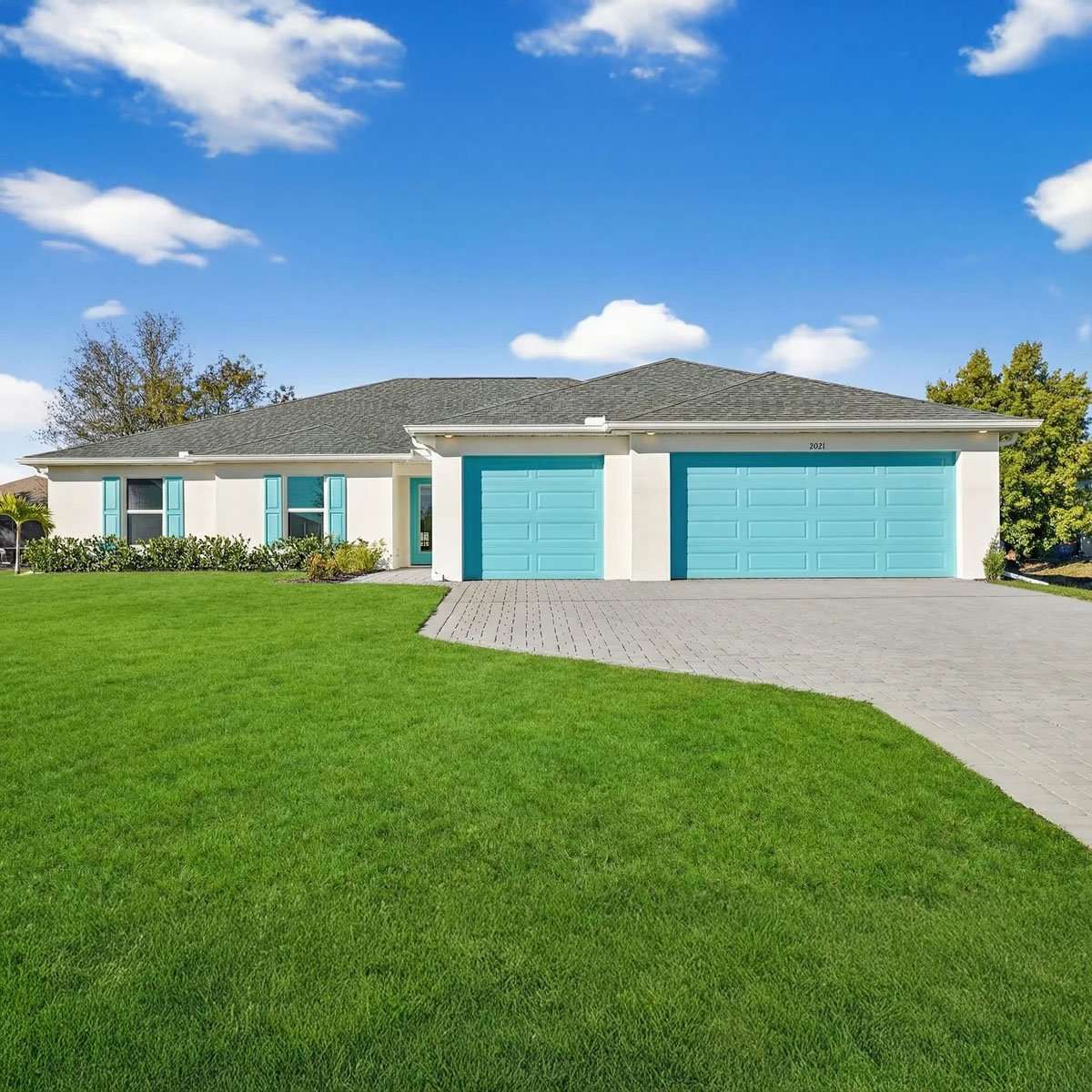 Front exterior of a new SunLife Paradise Cove home with a two-car garage